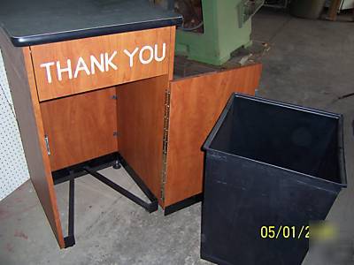 Waste receptacle with tray storage