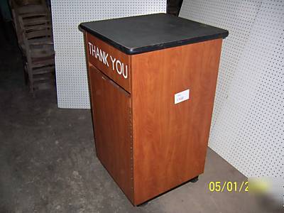 Waste receptacle with tray storage