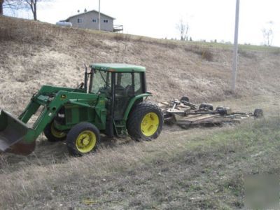 1999 john deere 6200 4WD used to pull a rotary mower
