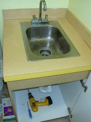 Yellow formica cabinets with 2 sinks 