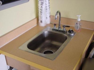Yellow formica cabinets with 2 sinks 