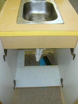 Yellow formica cabinets with 2 sinks 