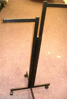 Black t-stand adj height straight arm clothes rack used