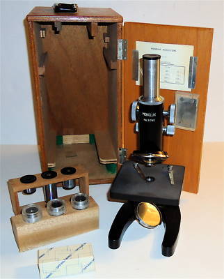 Monolux vintage microscope in wood box w/many extras 