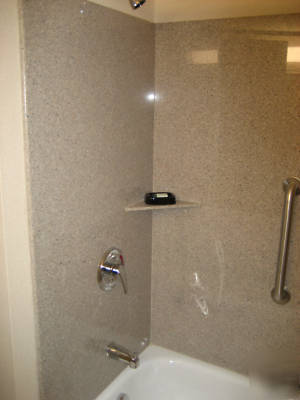 Solid granite bath surrounds--wave white