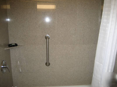 Solid granite bath surrounds--wave white