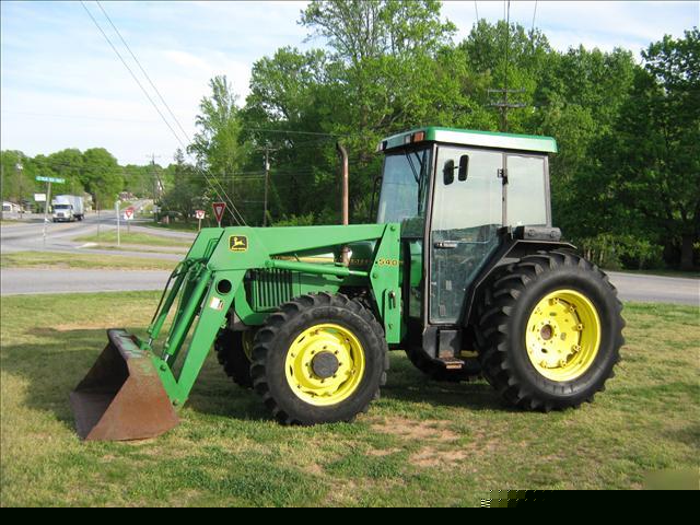 Very nice 5500 john deere 4X4 cab loader tractor