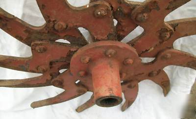 Cast iron red spiral sun shaped tiller blade old ny
