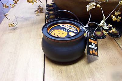 Halloween orange hot chocolate in tin witch's cauldron