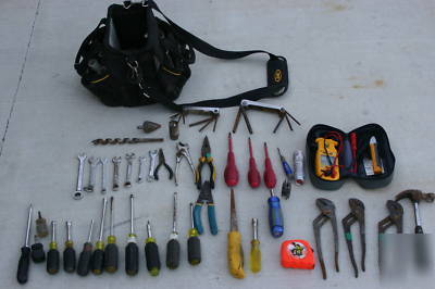 Assortment of electricians hand tools and tool bag