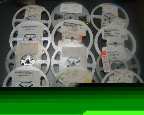 Lot of 12 reels of mixed quantity capacitors